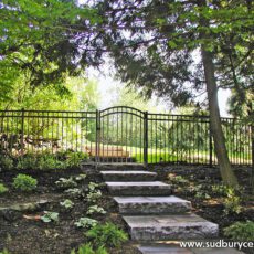 Aluminum Wrought Iron Fence by Sudbury Cedar Fence Co provides a welcoming entrance in Bolton, MA