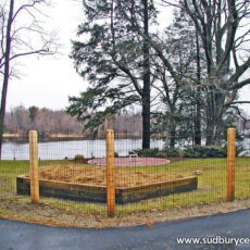 Wire Fence On Cedar Posts around garden area by Sudbury Cedar Fence Co in Hudson, MA