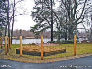 Wire Fence On Cedar Posts around garden area by Sudbury Cedar Fence Co in Hudson, MA