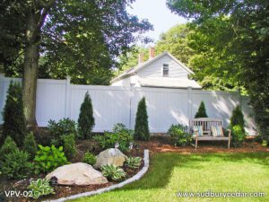 White vinyl privacy fence creating a clean, secluded backyard retreat in Maynard, Massachusetts.