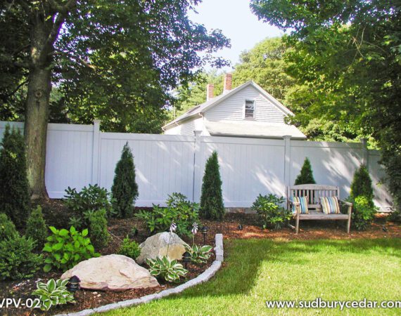 White vinyl privacy fence creating a clean, secluded backyard retreat in Maynard, Massachusetts.