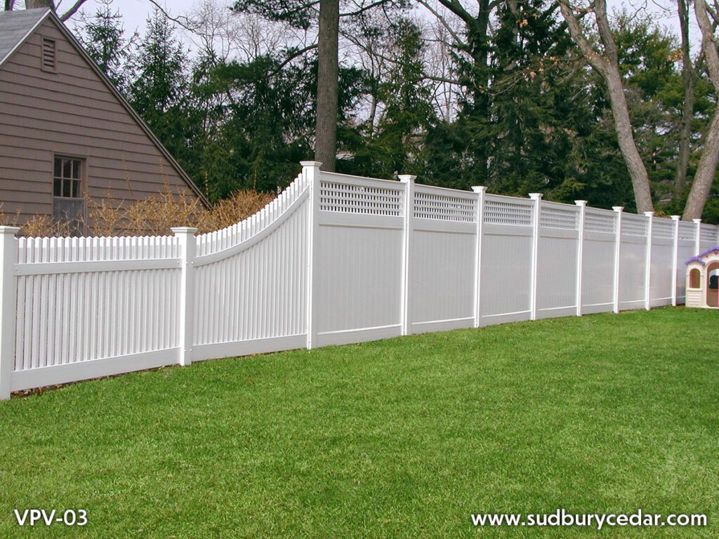 Custom white vinyl privacy fence with decorative lattice-top panels and curved transition design installed in MetroWest Massachusetts, combining backyard privacy with elegant architectural detail and low-maintenance durability.