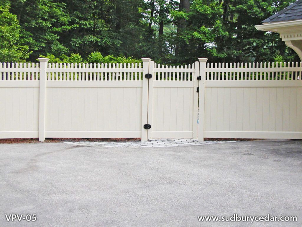 Custom white vinyl privacy fence with matching decorative gate and lattice-top accents installed in Massachusetts, designed to provide secure backyard privacy with a clean, elegant low-maintenance finish.