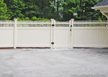 Custom white vinyl privacy fence with matching decorative gate and lattice-top accents installed in Massachusetts, designed to provide secure backyard privacy with a clean, elegant low-maintenance finish.