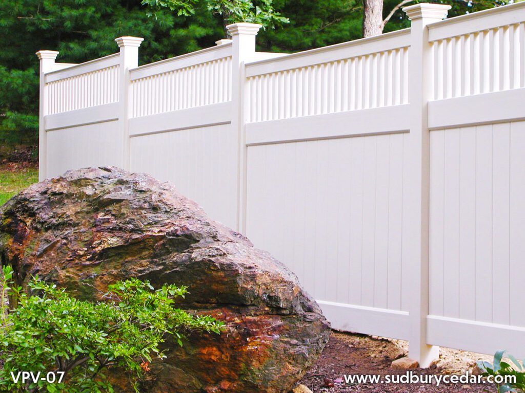 White vinyl board fence with decorative topper in MetroWest MA.
