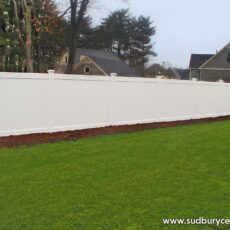 White vinyl board fence by Sudbury Cedar Fence Co