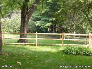 Round Cedar Post & Rail Fence With Welded Wire by Sudbury Cedar Fence Co in Stow, MA