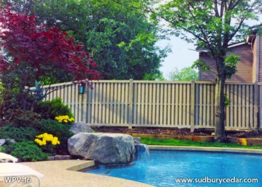 Beautiful Cedar Shadow Box Fence by Sudbury Cedar Fence Co surrounds a pool in Wayland, MA