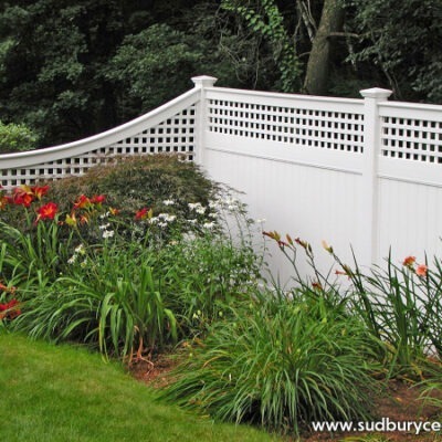 Vinyl fence with decorative top in Acton, MA. Sudbury Cedar Fence Co