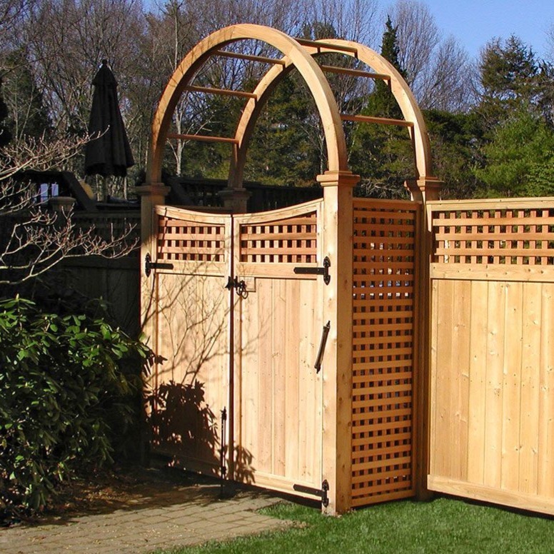 Custom cedar fence gate with arched arbor designed to enhance curb appeal in MetroWest MA by Sudbury Cedar Fence Co.