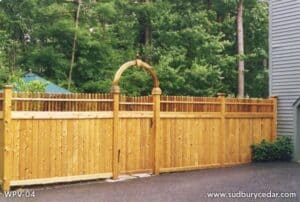 Northern white cedar privacy fence with arbor gate highlighting natural wood grain and timeless beauty in MetroWest Massachusetts