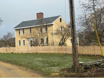 cedar spaced picket fence installed around residential property in stow massachusetts