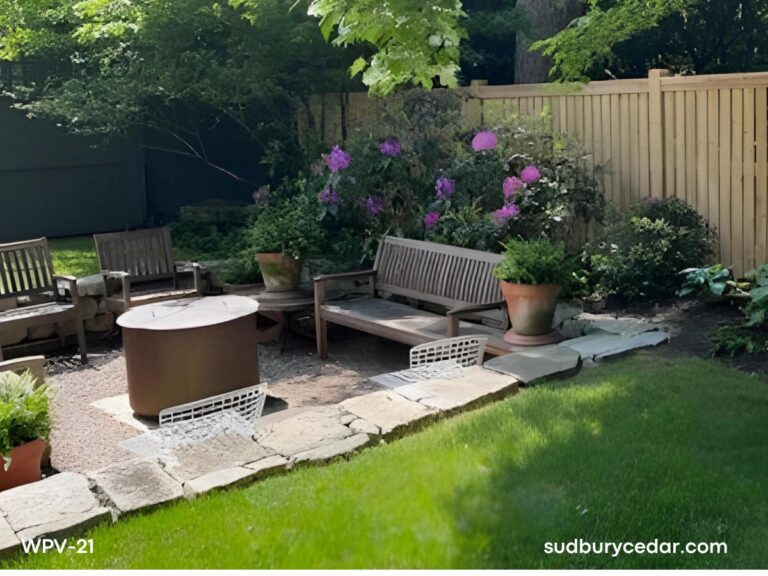 cedar privacy fence surrounding backyard patio and seating area in concord massachusetts