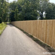 Long cedar privacy fence installed along MCRT bike path Hudson MA
