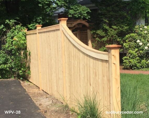 Curved top cedar privacy fence with custom shape and natural wood finish in Concord, MA.