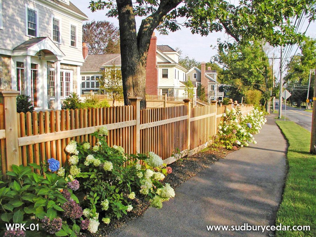cedar picket fence installed along landscaped front yard in metrowest massachusetts