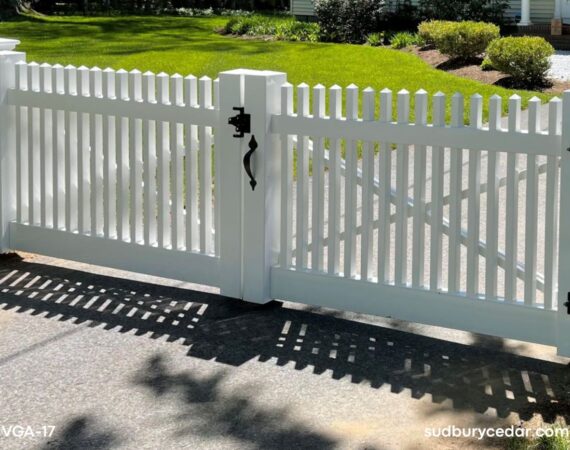 Custom white vinyl driveway gate with black hardware installed in Concord Massachusetts