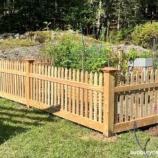 cedar picket garden enclosure installed in landscaped backyard in weston massachusetts