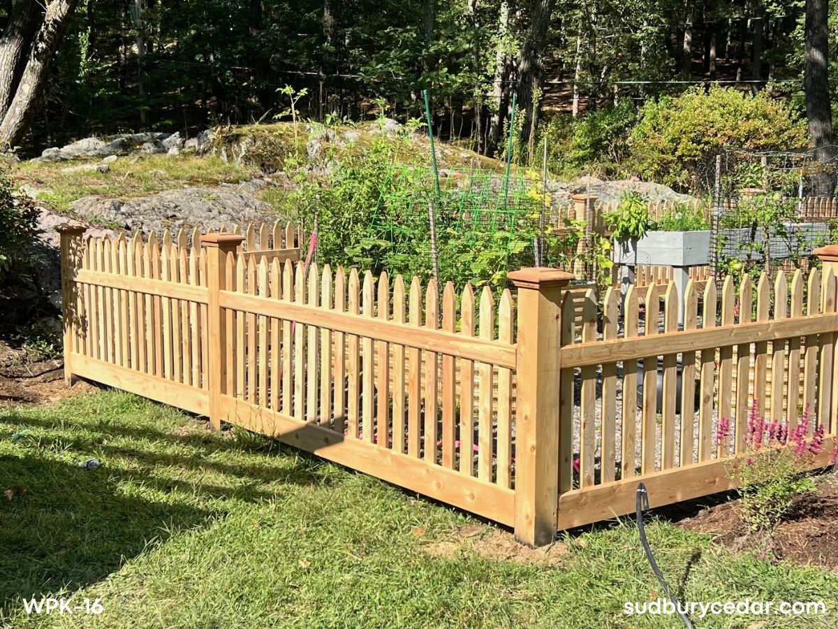 cedar picket garden enclosure installed in landscaped backyard in weston massachusetts