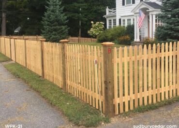 cedar picket fence installed along residential front yard in sudbury massachusetts