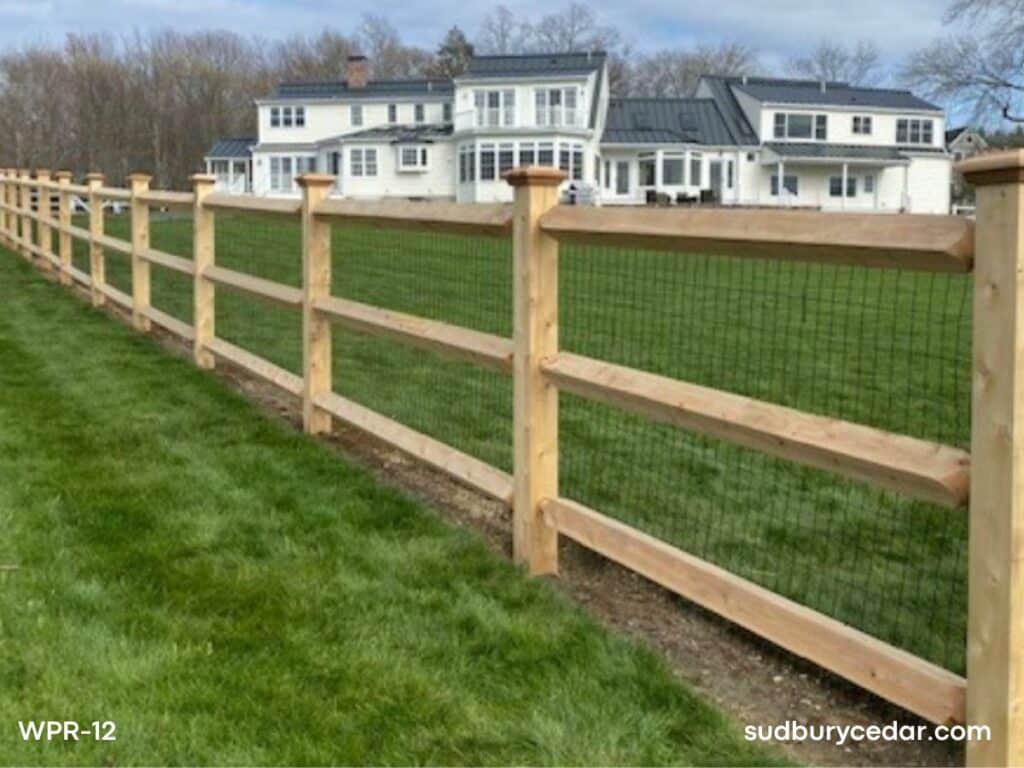 cedar post and rail fence with wire mesh surrounding large residential property in harvard ma