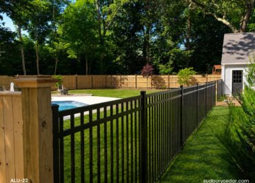 Aluminum and cedar fencing around pool in Concord, MA.