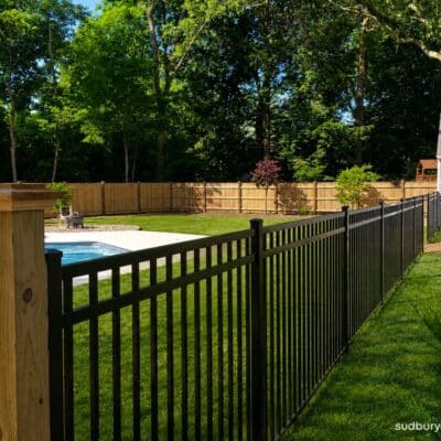 Aluminum and cedar fencing around pool in Concord, MA.