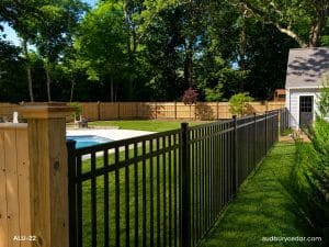 Aluminum and cedar fencing around pool in Concord, MA.