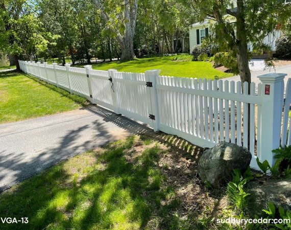 White vinyl driveway gate with picket fence-Concord, MA.