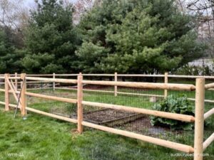 Garden fence of cedar post and rail with wire -MetroWest MA.