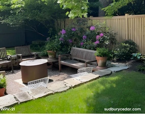Cedar privacy fence in landscaped backyard.