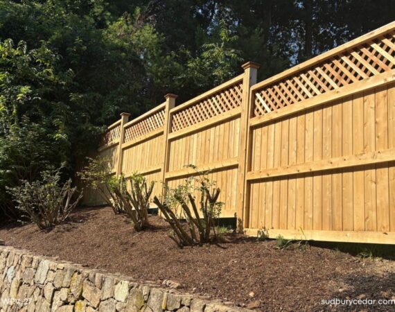 Custom cedar fence stepped with land-Wayland, MA.