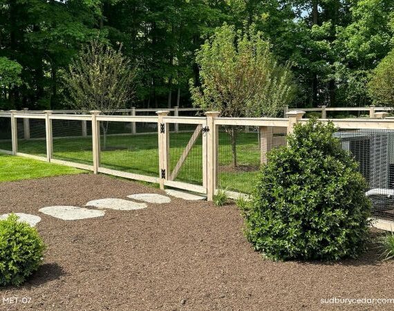 Cedar framed wire dog fence in Concord, MA.